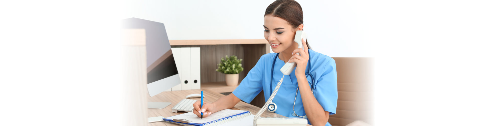 female medical assistant taking a call
